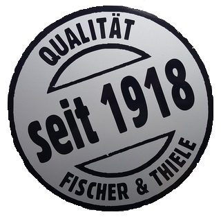 Rundes Logo mit der Aufschrift "Qualität seit 1918" und "Fischer & Thiele".